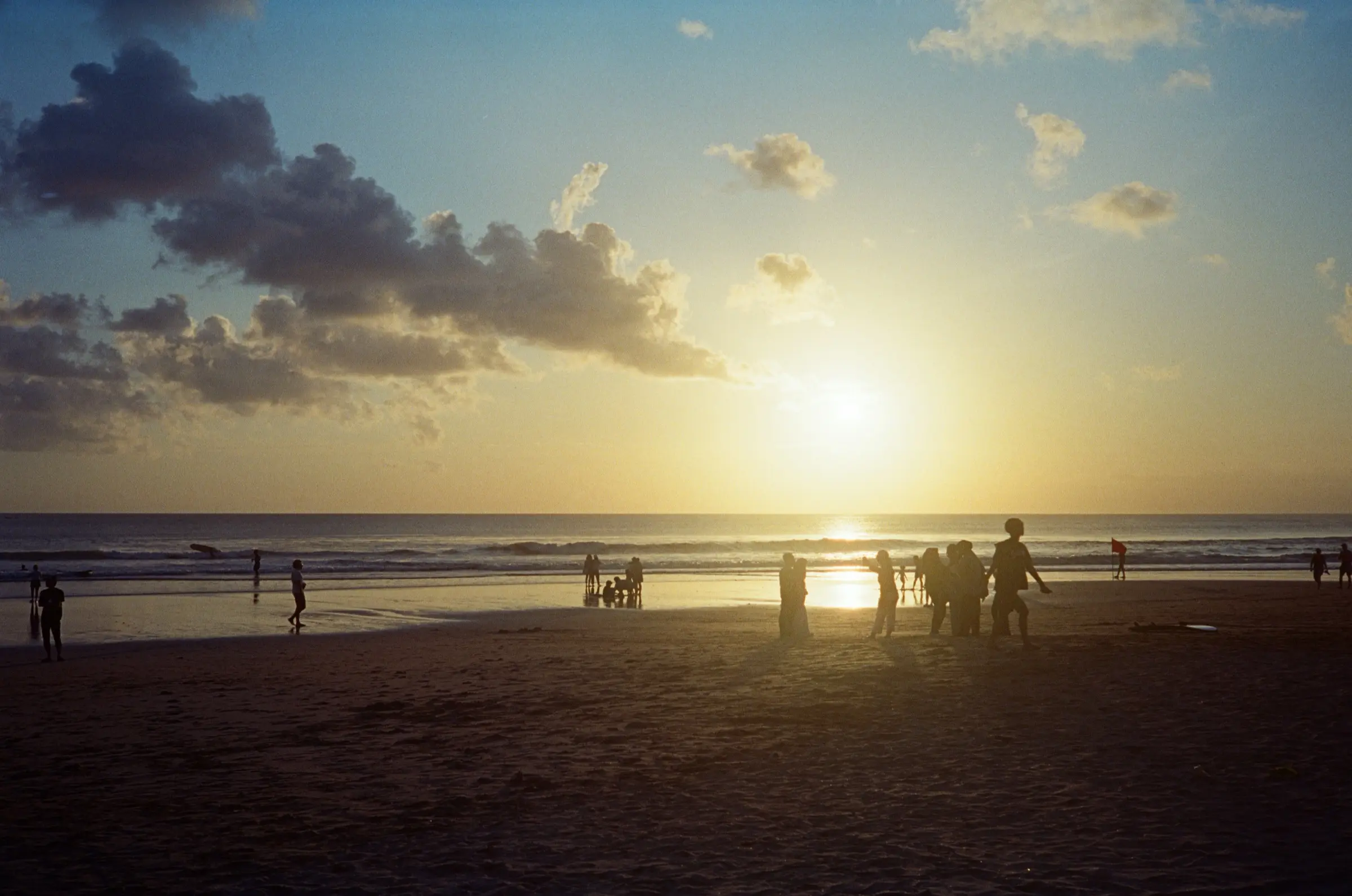 Silhouettes on a beach at golden hour